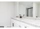 Bathroom featuring granite countertops, white cabinets, black fixtures, and walk-in shower at 3413 Arabian Farm Ln, Dacula, GA 30019