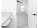 View into carpeted bedroom with granite countertop vanity and open door at 3413 Arabian Farm Ln, Dacula, GA 30019