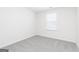 Carpeted bedroom features one window, neutral colors, and carpet flooring at 3413 Arabian Farm Ln, Dacula, GA 30019