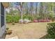 Expansive backyard featuring vibrant azaleas and manicured landscaping at 1010 Pinehurst Dr, Peachtree City, GA 30269