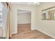 Bedroom with hardwood floors, light-colored walls, and doorway into another room at 1010 Pinehurst Dr, Peachtree City, GA 30269