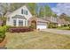 Attractive home with a spacious driveway and lush green lawn at 1010 Pinehurst Dr, Peachtree City, GA 30269