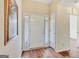 Bright foyer with hardwood floors, a white front door, and side panel windows at 1010 Pinehurst Dr, Peachtree City, GA 30269