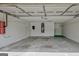 Spacious two-car garage featuring a water heater, painted walls, and ample storage space at 1010 Pinehurst Dr, Peachtree City, GA 30269