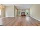 Spacious living room with elegant chandelier, fireplace and ample natural light at 1010 Pinehurst Dr, Peachtree City, GA 30269