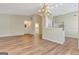 Spacious living room featuring hardwood floors and a view into the modern kitchen area at 1010 Pinehurst Dr, Peachtree City, GA 30269