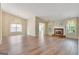 Spacious living room featuring a fireplace and large windows at 1010 Pinehurst Dr, Peachtree City, GA 30269