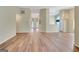 Open-concept living room with chandelier and view of foyer at 1010 Pinehurst Dr, Peachtree City, GA 30269