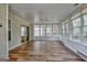 Sun room with hardwood floors, light-colored walls, and multiple windows providing ample natural light at 1010 Pinehurst Dr, Peachtree City, GA 30269