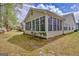 Bright sunroom featuring many windows, offering natural light and panoramic views of the backyard at 1010 Pinehurst Dr, Peachtree City, GA 30269