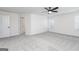Bedroom featuring neutral carpet, a ceiling fan, with natural light and a paneled interior door at 3402 Arabian Farm Ln, Dacula, GA 30019