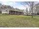Large backyard view from the back of the home with covered porch and deck at 12435 Hamilton Rd # 536/- Ac, Chattahoochee Hills, GA 30268