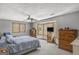 Bright bedroom featuring a large bay window and cozy carpeting at 12435 Hamilton Rd # 536/- Ac, Chattahoochee Hills, GA 30268