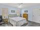 Light-filled bedroom with blue walls, a ceiling fan, and traditional-style furniture at 12435 Hamilton Rd # 536/- Ac, Chattahoochee Hills, GA 30268