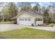 Exterior of garage with car port, multiple parking spots, and outdoor lighting at 12435 Hamilton Rd # 536/- Ac, Chattahoochee Hills, GA 30268