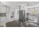 Open kitchen featuring stainless steel refrigerator, granite countertop island and view of bedroom at 12435 Hamilton Rd # 536/- Ac, Chattahoochee Hills, GA 30268