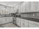 Well-lit kitchen with stainless steel appliances and sleek white cabinetry at 12435 Hamilton Rd # 536/- Ac, Chattahoochee Hills, GA 30268
