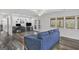 Living room featuring hardwood floors, access to a deck, and a dedicated workspace at 12435 Hamilton Rd # 536/- Ac, Chattahoochee Hills, GA 30268