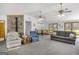 Open-concept living room featuring a vaulted ceiling, a stone fireplace, and comfortable seating at 12435 Hamilton Rd # 536/- Ac, Chattahoochee Hills, GA 30268