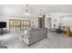 Spacious living room featuring vaulted ceiling, three ceiling fans, and a stone fireplace at 12435 Hamilton Rd # 536/- Ac, Chattahoochee Hills, GA 30268
