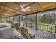 Covered porch featuring a ceiling fan, outdoor seating, and a backyard view at 12435 Hamilton Rd # 536/- Ac, Chattahoochee Hills, GA 30268