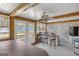 Enclosed sunroom featuring a hot tub, outdoor bar, and abundant natural light at 12435 Hamilton Rd # 536/- Ac, Chattahoochee Hills, GA 30268