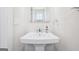Clean bathroom with a pedestal sink and neutral color scheme at 864 Maduro Way, Mcdonough, GA 30253