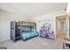 This bedroom has a fun bunk bed and play area, making it a perfect space for imaginative play at 864 Maduro Way, Mcdonough, GA 30253