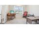 Home office setup with a large window, providing natural light at 864 Maduro Way, Mcdonough, GA 30253