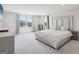 Large main bedroom with a sitting area, natural light, and neutral colors at 864 Maduro Way, Mcdonough, GA 30253