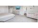 Primary bedroom with neutral colors, crib, dresser and lots of light at 864 Maduro Way, Mcdonough, GA 30253
