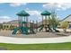 Well-maintained playground with modern equipment surrounded by lush green space, great for families at 864 Maduro Way, Mcdonough, GA 30253