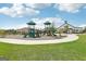 Community playground with slides and play areas, perfect for outdoor fun and recreation at 864 Maduro Way, Mcdonough, GA 30253