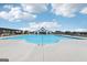 Large swimming pool area with ample space for recreation and community gatherings at 864 Maduro Way, Mcdonough, GA 30253