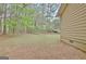 Home exterior view featuring a lush lawn and mature trees at 212 Bella Rosa, Peachtree City, GA 30269