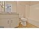 Bathroom with a granite countertop vanity, framed mirror, and shower-tub combo at 212 Bella Rosa, Peachtree City, GA 30269