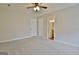Spacious bedroom with neutral carpet and access to an en-suite bathroom for added convenience at 212 Bella Rosa, Peachtree City, GA 30269