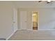 Bedroom with neutral carpet and access to an en-suite bathroom for added convenience at 212 Bella Rosa, Peachtree City, GA 30269