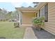 Inviting front porch with stylish details and landscaping at 212 Bella Rosa, Peachtree City, GA 30269