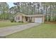 Lovely single-story home with a well-kept lawn, driveway, and attached garage at 212 Bella Rosa, Peachtree City, GA 30269