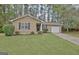 Charming single-story home featuring a well-manicured lawn and cozy curb appeal at 212 Bella Rosa, Peachtree City, GA 30269