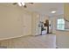 Bright kitchen with stainless steel appliances, white cabinets, and hardwood flooring at 212 Bella Rosa, Peachtree City, GA 30269