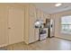 Functional kitchen with stainless steel appliances, white cabinetry, and hardwood flooring at 212 Bella Rosa, Peachtree City, GA 30269