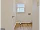 Laundry room with vinyl floors, a window, and washer/dryer hookups at 212 Bella Rosa, Peachtree City, GA 30269