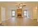 Open living area with fireplace, fresh paint, and updated flooring at 212 Bella Rosa, Peachtree City, GA 30269