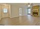Bright living room with new flooring, a cozy fireplace, and a backyard view at 212 Bella Rosa, Peachtree City, GA 30269