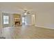 Spacious living room featuring a stone fireplace, ample natural light, and modern flooring at 212 Bella Rosa, Peachtree City, GA 30269