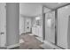 Modern bathroom with double vanity, white cabinets, framed mirrors, and walk-in shower at 176 Butler Rd, Brooks, GA 30205