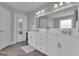 Bright bathroom with double sink vanity, ample storage and framed mirror at 176 Butler Rd, Brooks, GA 30205