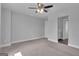 Empty bedroom with carpet, ceiling fan, adjoining room, and lots of light at 176 Butler Rd, Brooks, GA 30205